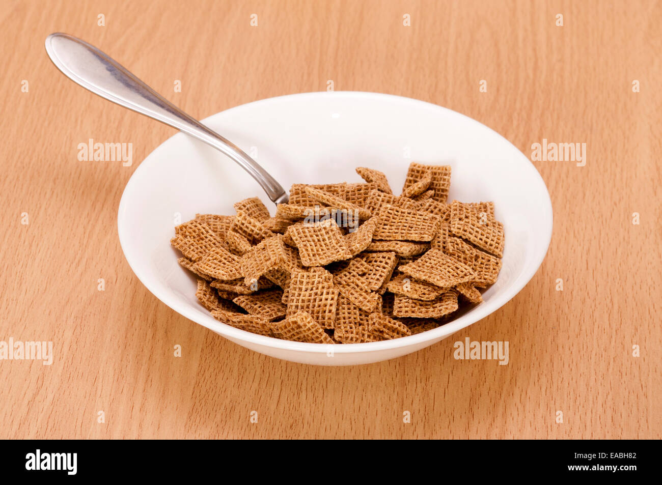 Bowl Of Breakfast Cereal with a Spoon Shreddies nestle Products Stock