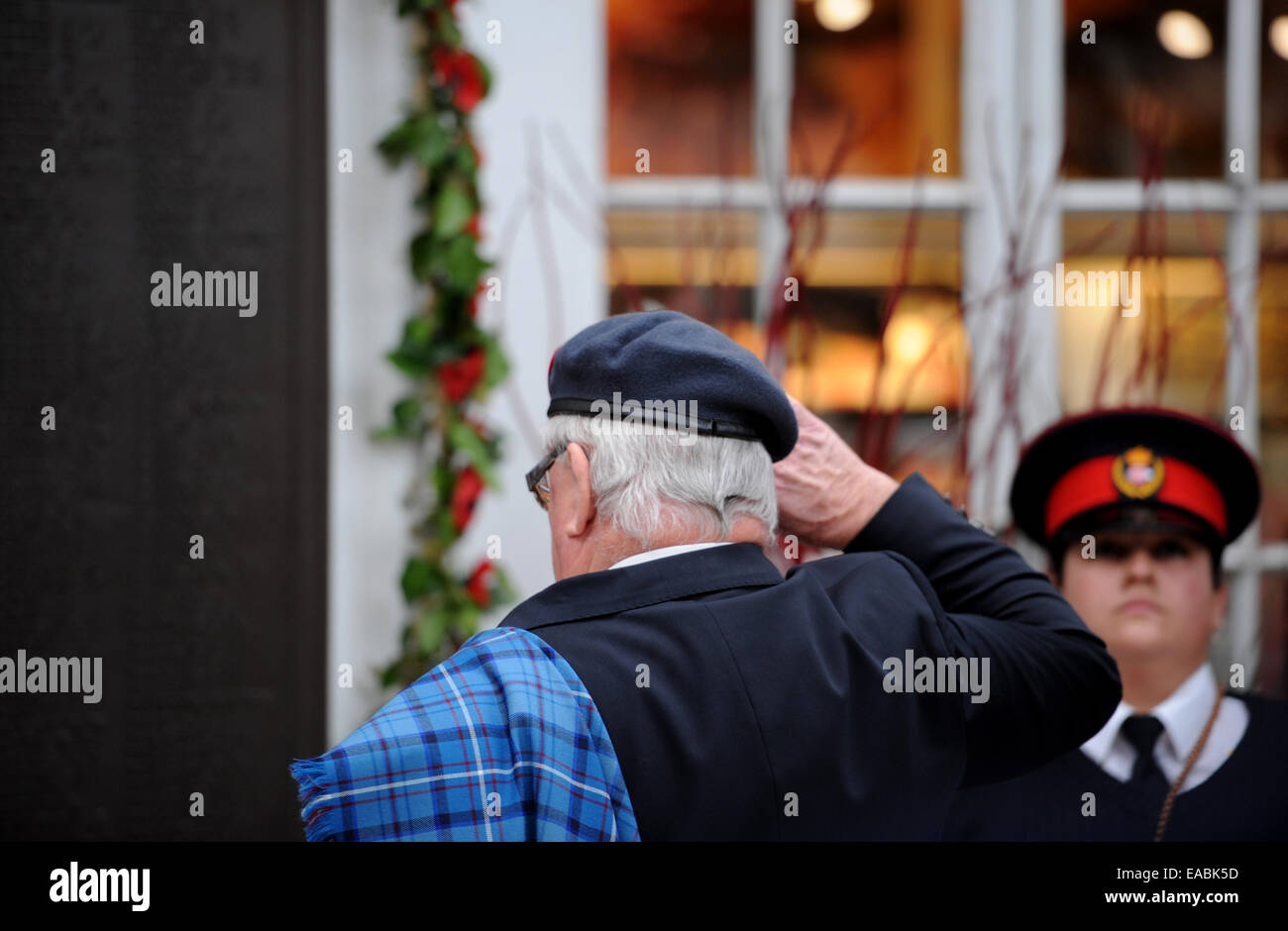 Brighton, UK. 11th November, 2014. Members of the RAF Police Association and Blind Veterans UK lead a Guard of Honour Parade and two minutes silence at Brighton Railway Station at 11am for Armistice Day Remembrance . Stock Photo