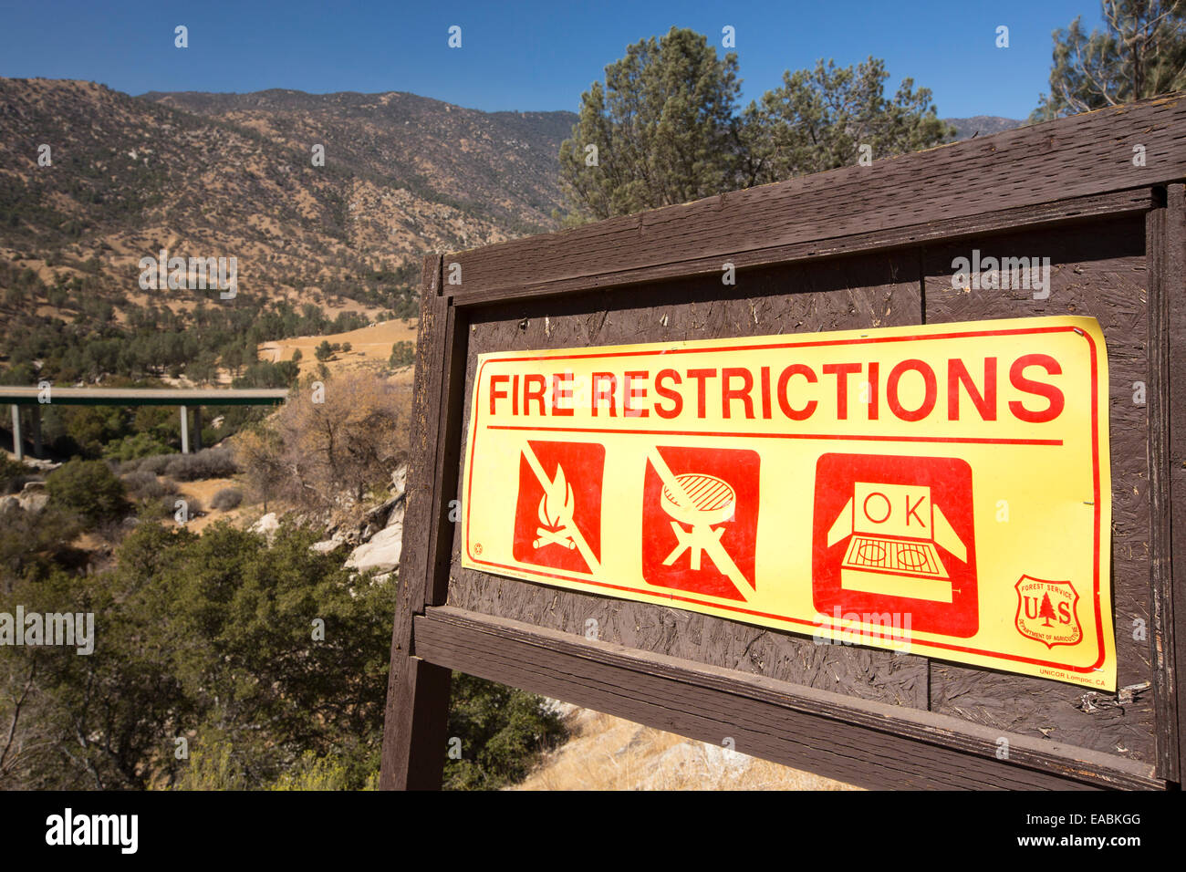 A fire restrictions sign by the Kern River below Lake Isabella