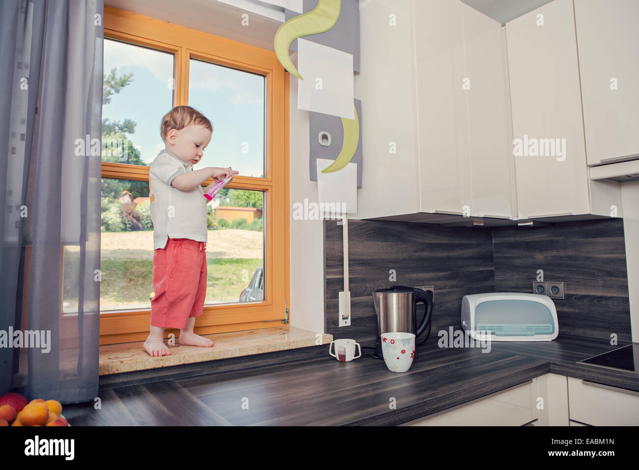 a 1,5 years old boy in the kitchen Stock Photo Alamy