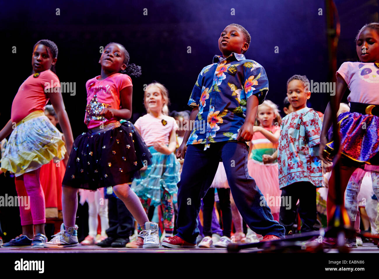 London, UK. 10th November, 2014. St Elphege's Infant Choir (age 5-8) sing a medley of songs from countries where they have their roots: Caribbean inspired...at the Music for Youth Schools Prom 2014 at the Royal Albert Hall. Credit:  Alick Cotterill/Alamy Live News Stock Photo