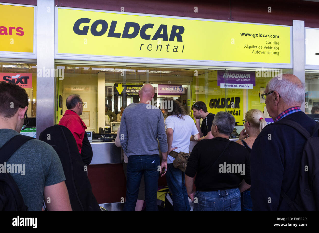 Queue at the Goldcar car rental office at Tenerife Sur airport, Canary  Islands, Spain Stock Photo - Alamy