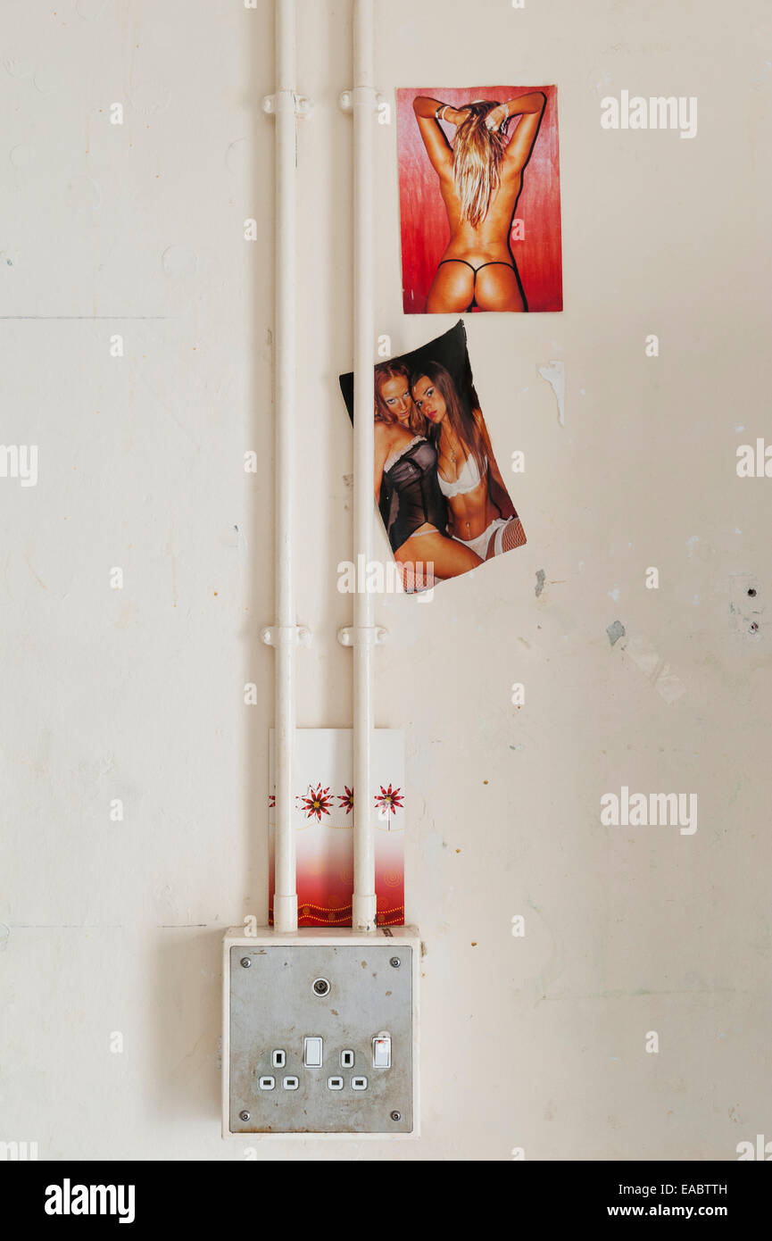 HMP Lancaster Castle, Lancashire, UK. Interior of a prison cell in 'A' wing - pinup photos put up by a prisoner Stock Photo