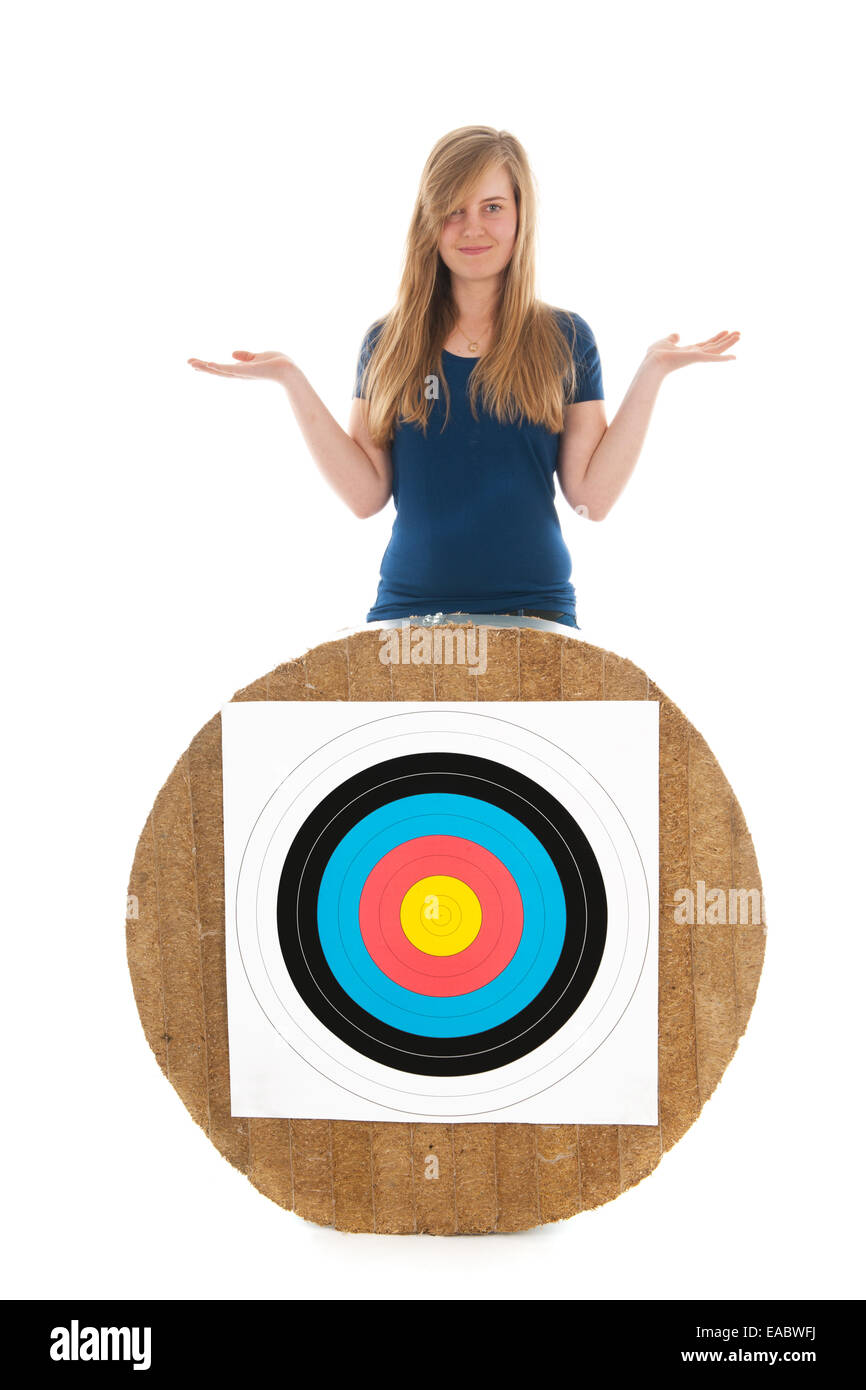 Teen girl behind archery target isolated over white background Stock ...