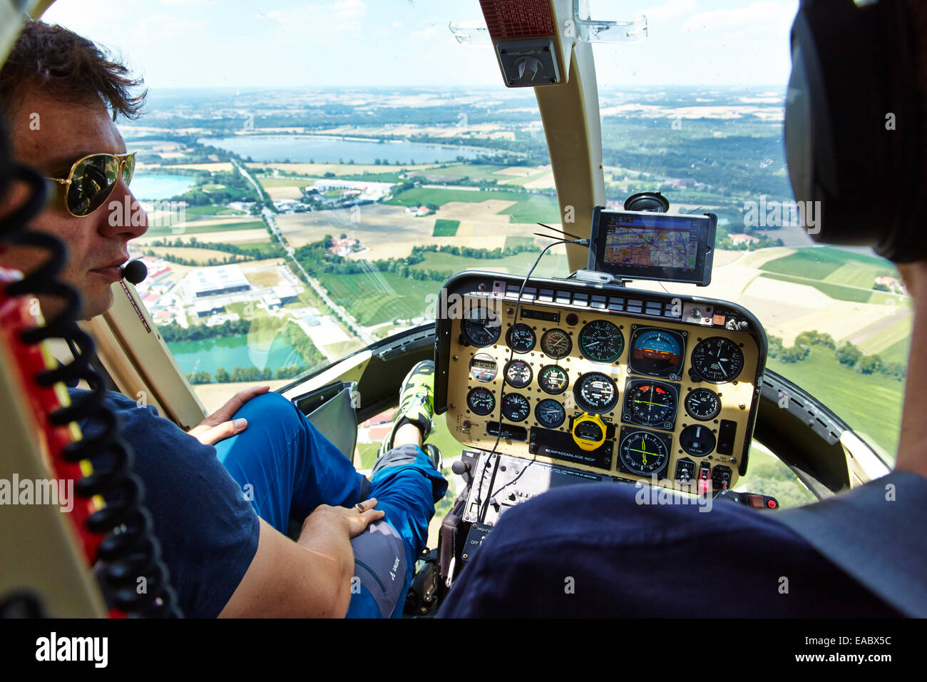 Germany Bavaria pilot and copilot in cockpit of a helicopter Stock Photo