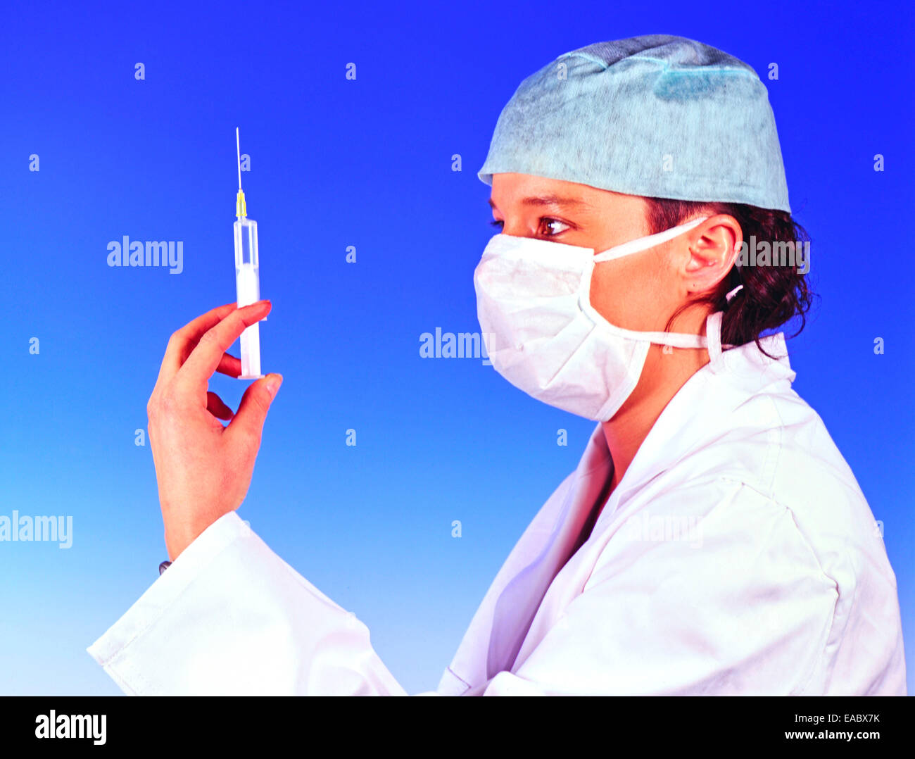 Female Doctor with Injection in her hand Stock Photo