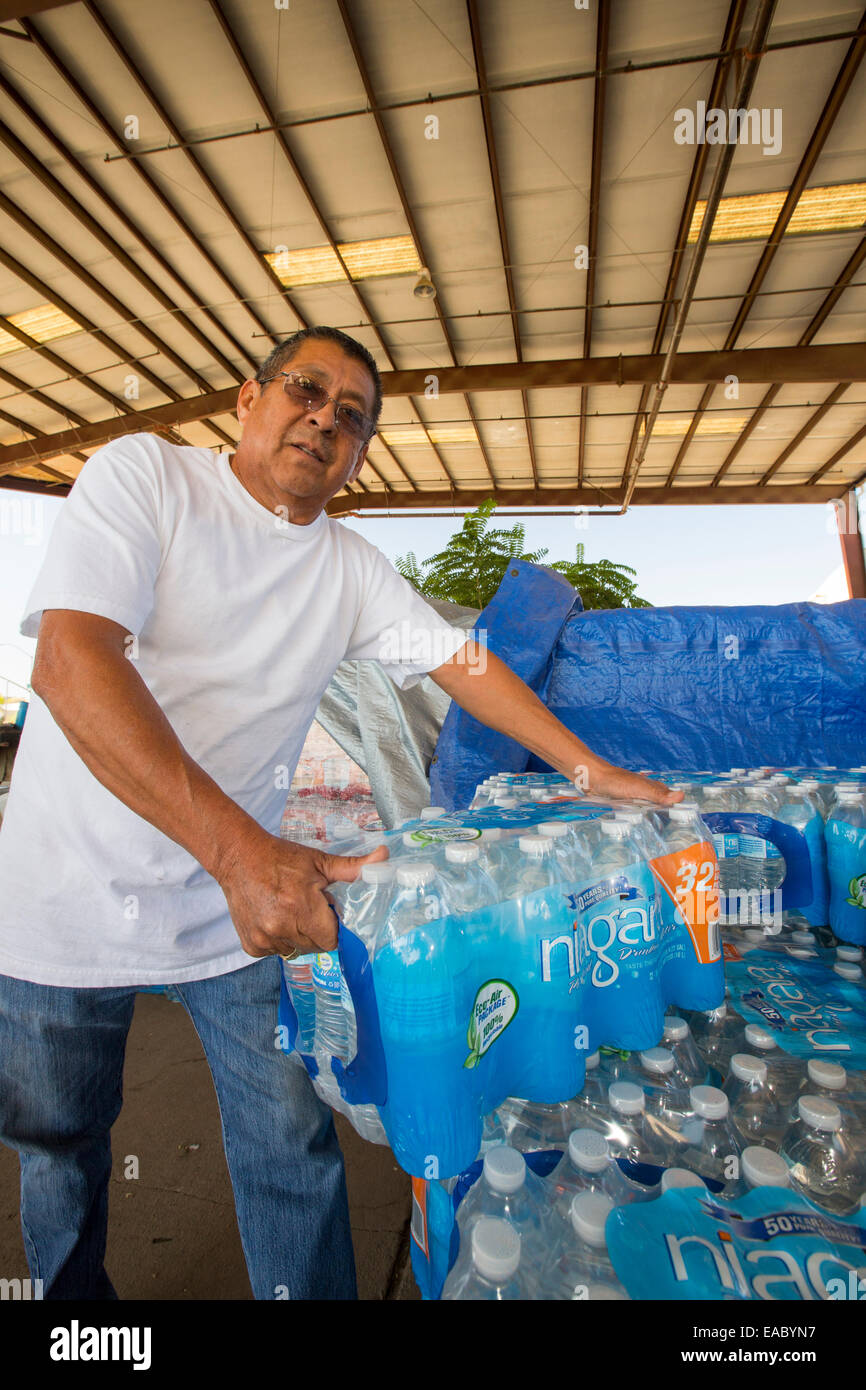 A water charity in Porterville supplying bottled water to houses who have had no running water for over five months, near Bakers Stock Photo