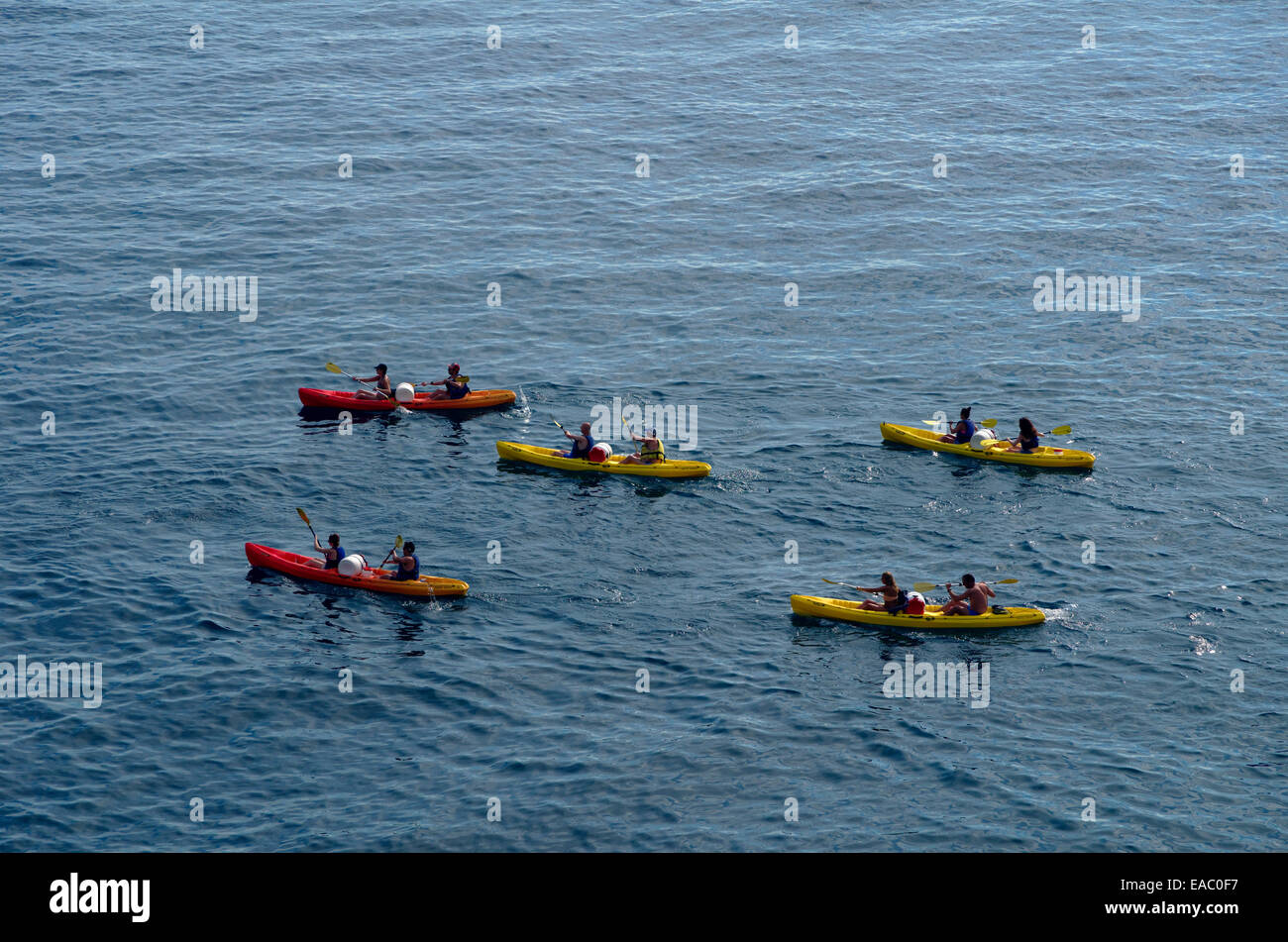 Group adventure in two seater kayaks. Stock Photo