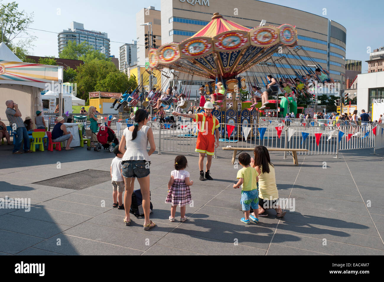 Juggler entertaining children on Place des Festivals, Montreal, province of Quebec, Canada. Stock Photo