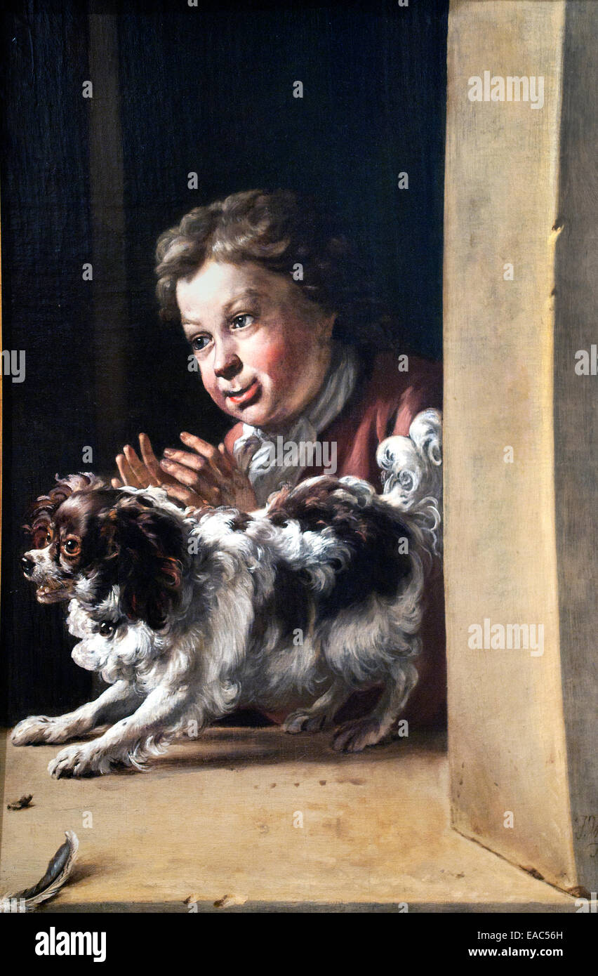 little boy holding dog painting