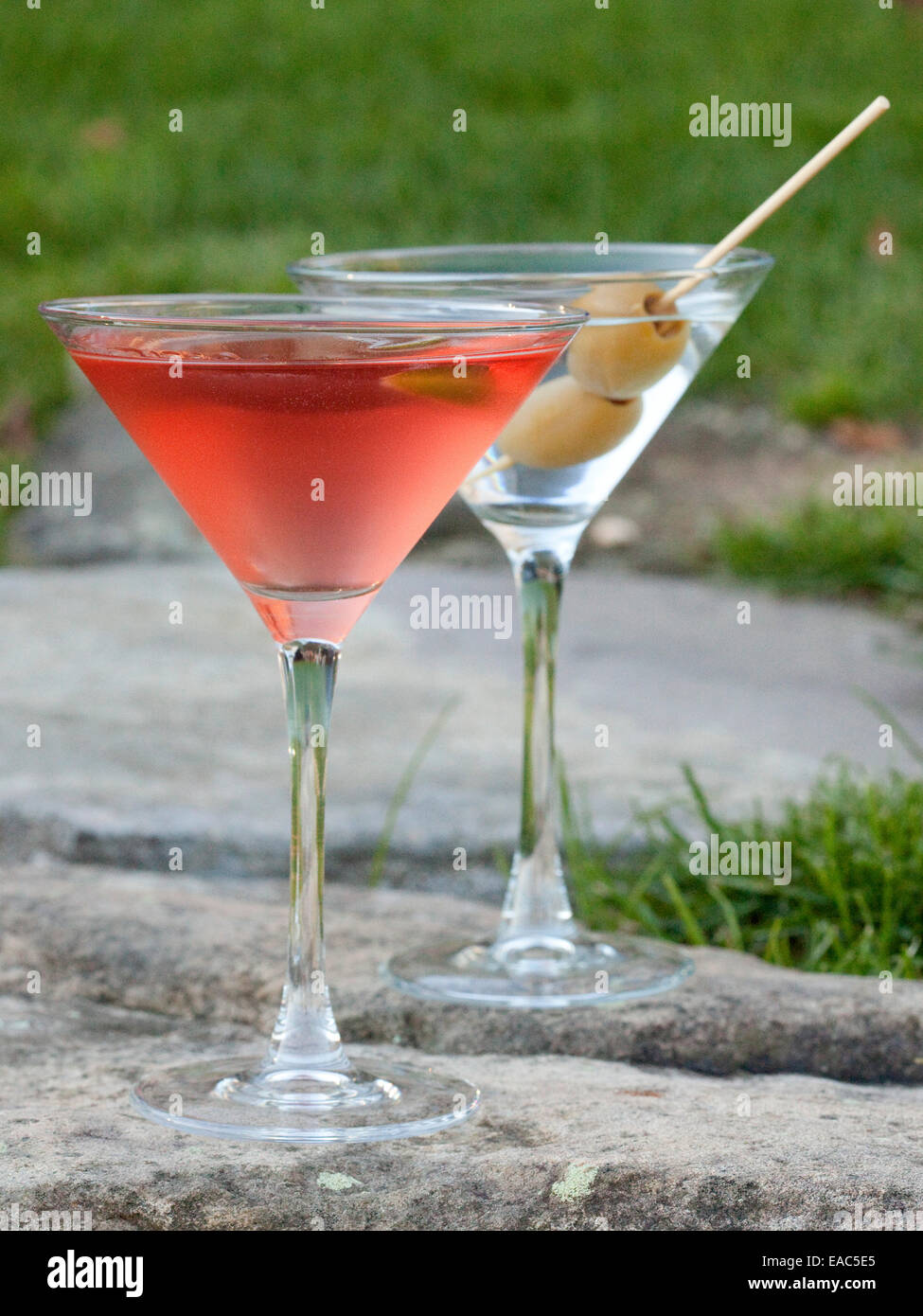 Cosmopolitan and and Martini on stone wall during outdoor reception Stock Photo