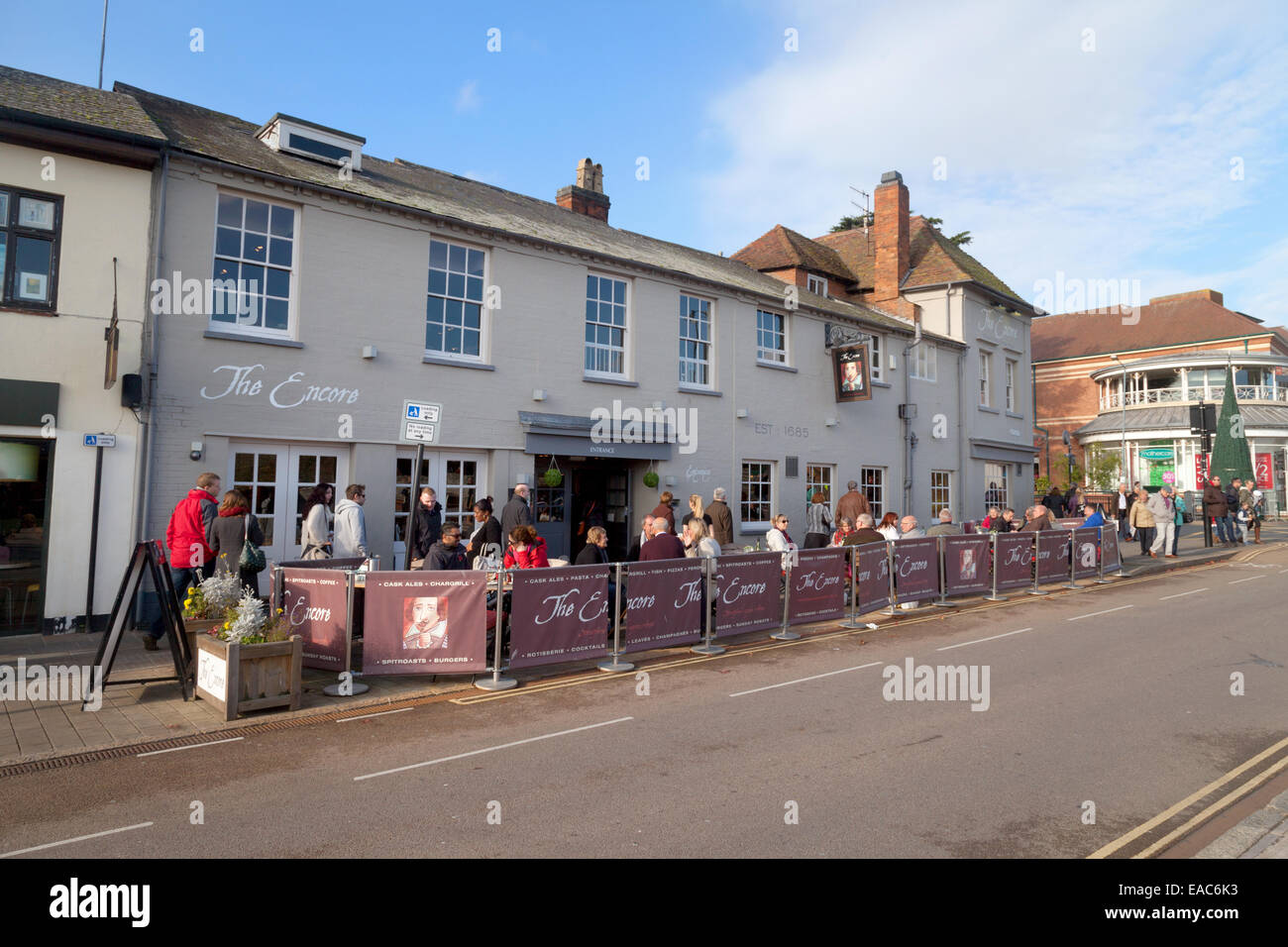 People drinking outside the Encore pub restaurant in the town centre, Stratford upon Avon, Warwickshire UK Stock Photo