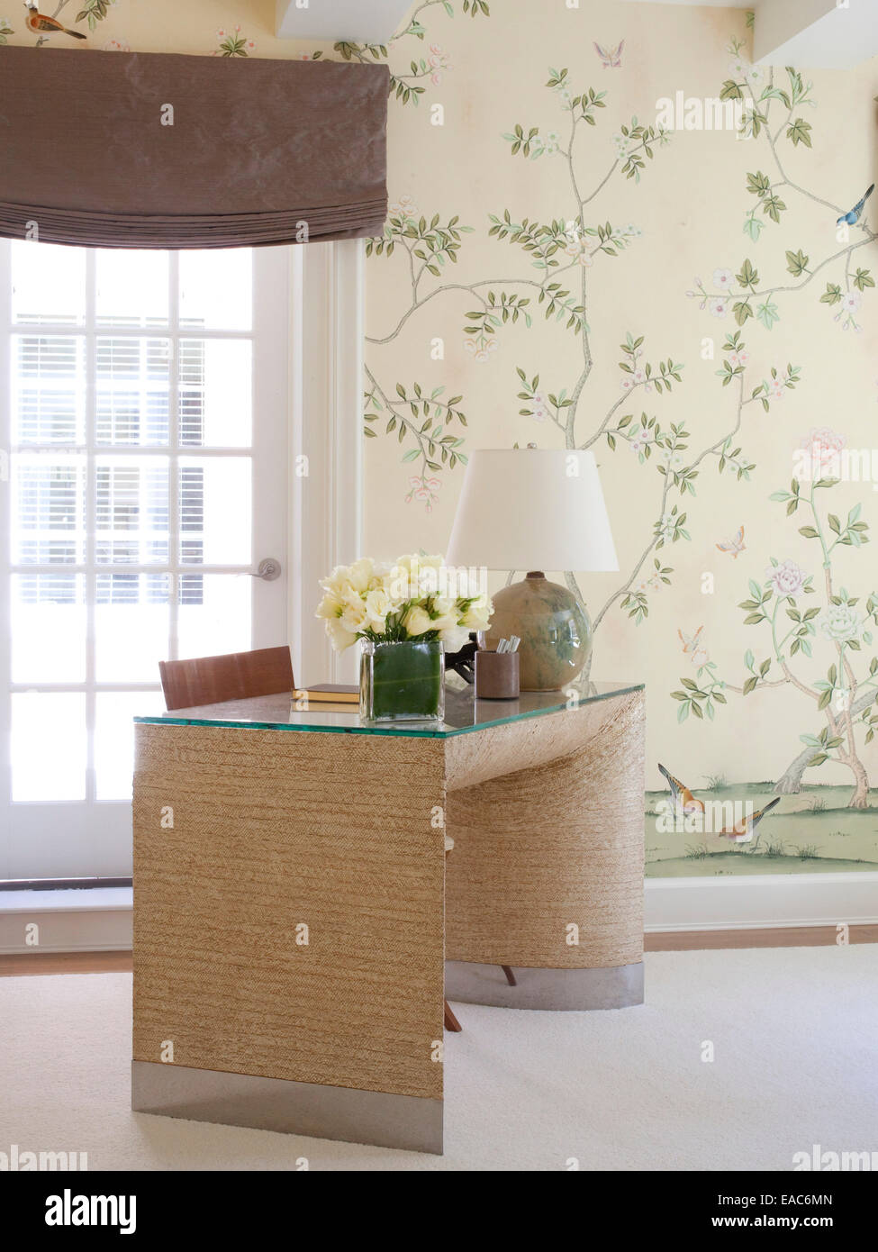 home study with desk and white roses Stock Photo