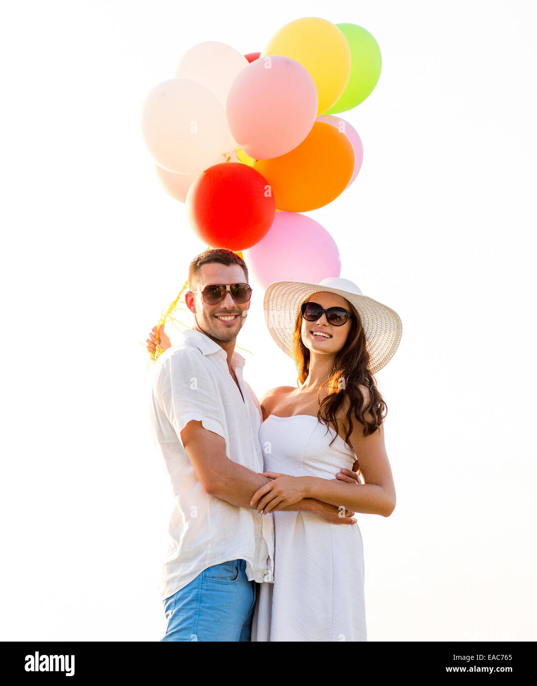 smiling couple with air balloons outdoors Stock Photo - Alamy