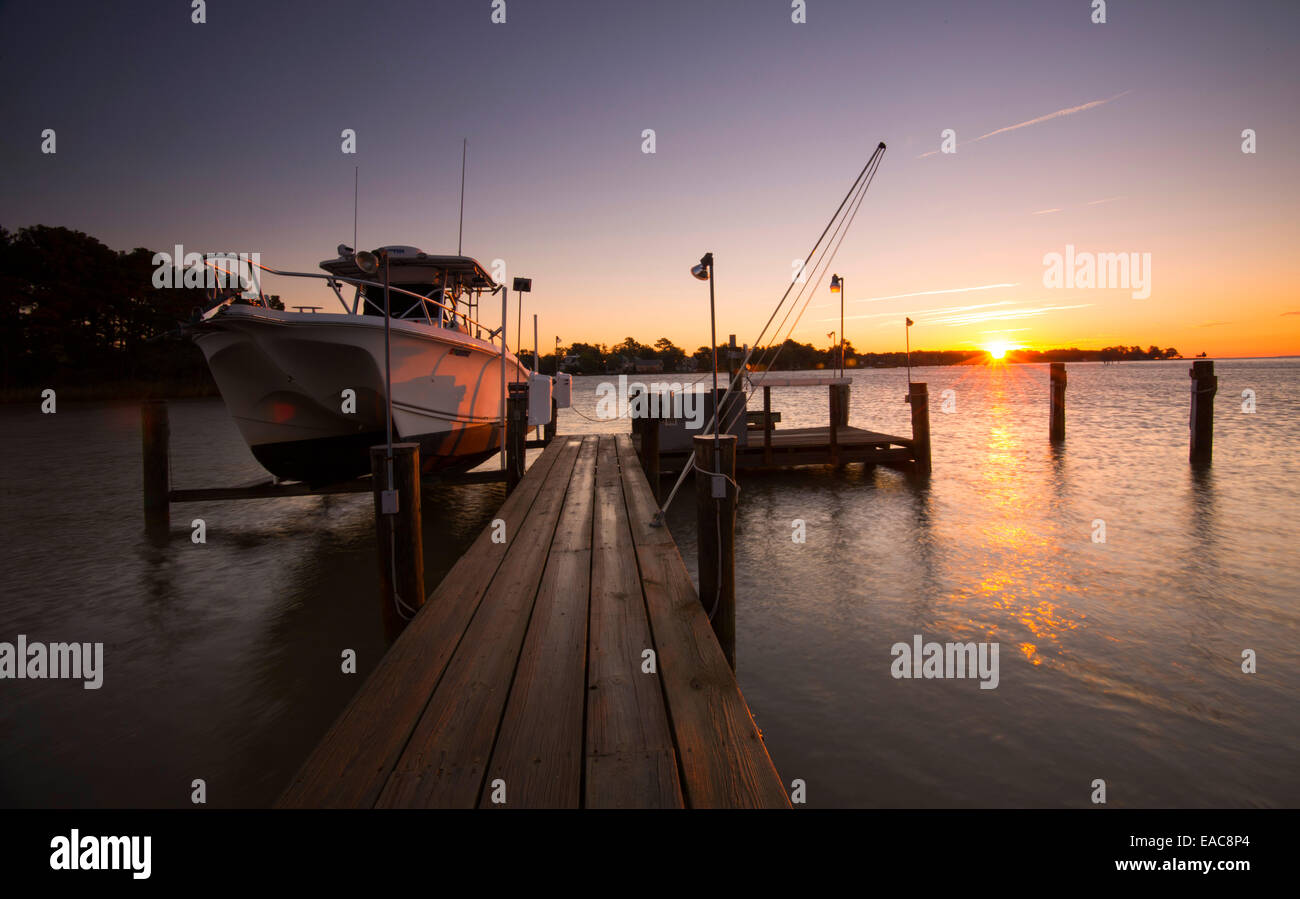 Golden sunrise by the dock of property on Tilghman Island, Talbot County Maryland USA Stock Photo
