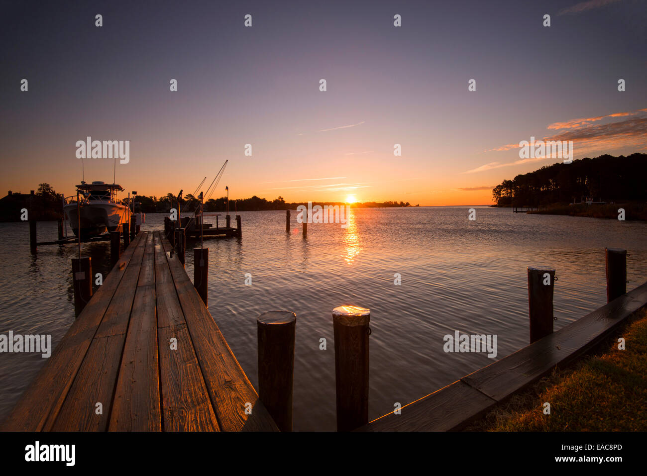 Golden sunrise by the dock of property on Tilghman Island, Talbot County Maryland USA Stock Photo