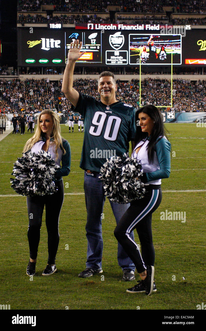 November 10, 2014: ESPN host Mike Golic waves to the crowd while flanked by Philadelphia Eagles cheerleaders as he is honored during the NFL game between the Carolina Panthers and Philadelphia Eagles at Lincoln Financial Field in Philadelphia, Pennsylvania. The Philadelphia Eagles won 45-21. Stock Photo
