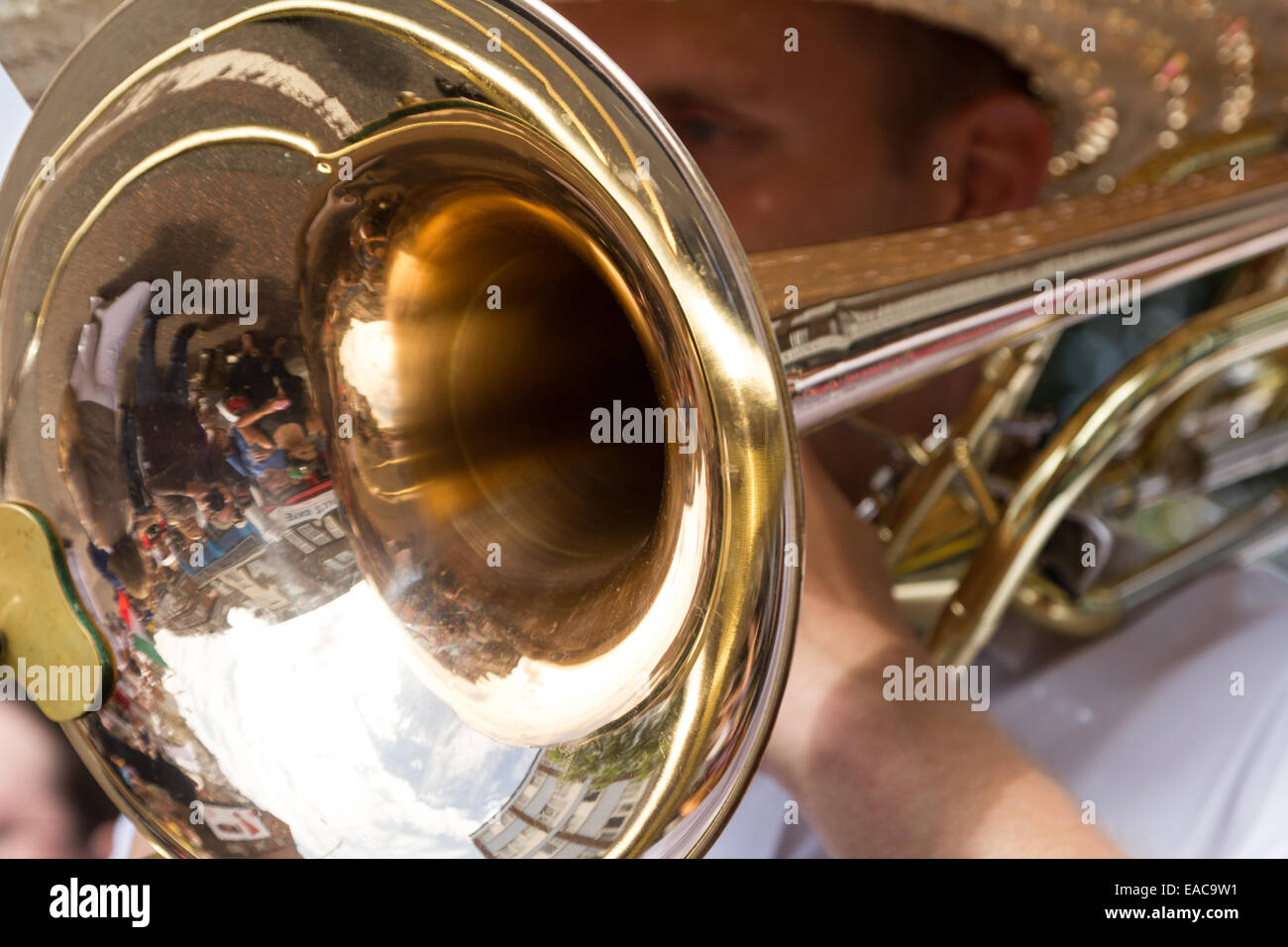 Man playing a trombone brass instrument marching at the Carnaval Del Pueblo London England Stock Photo