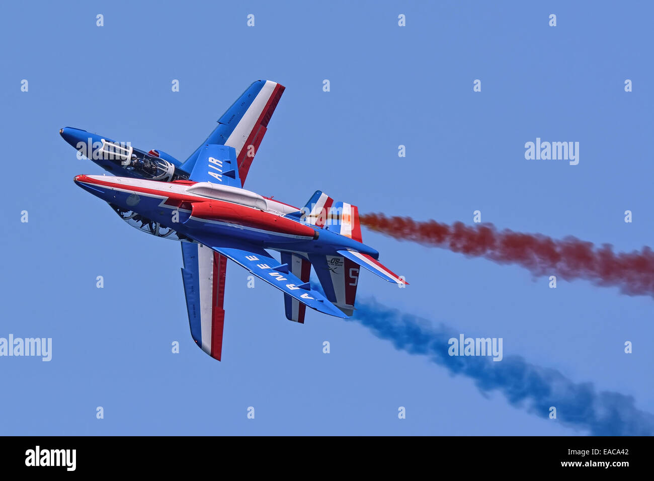Alpha Jet of Patrouille De France display team in flight Stock Photo
