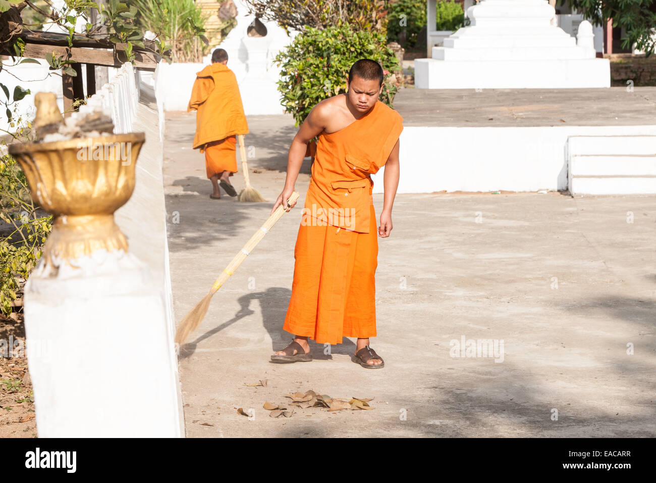 Buddhist monks cleaning temple at Ban Xang Khong village near Luang Prabang, Laos, South East Asia, Asia, Stock Photo