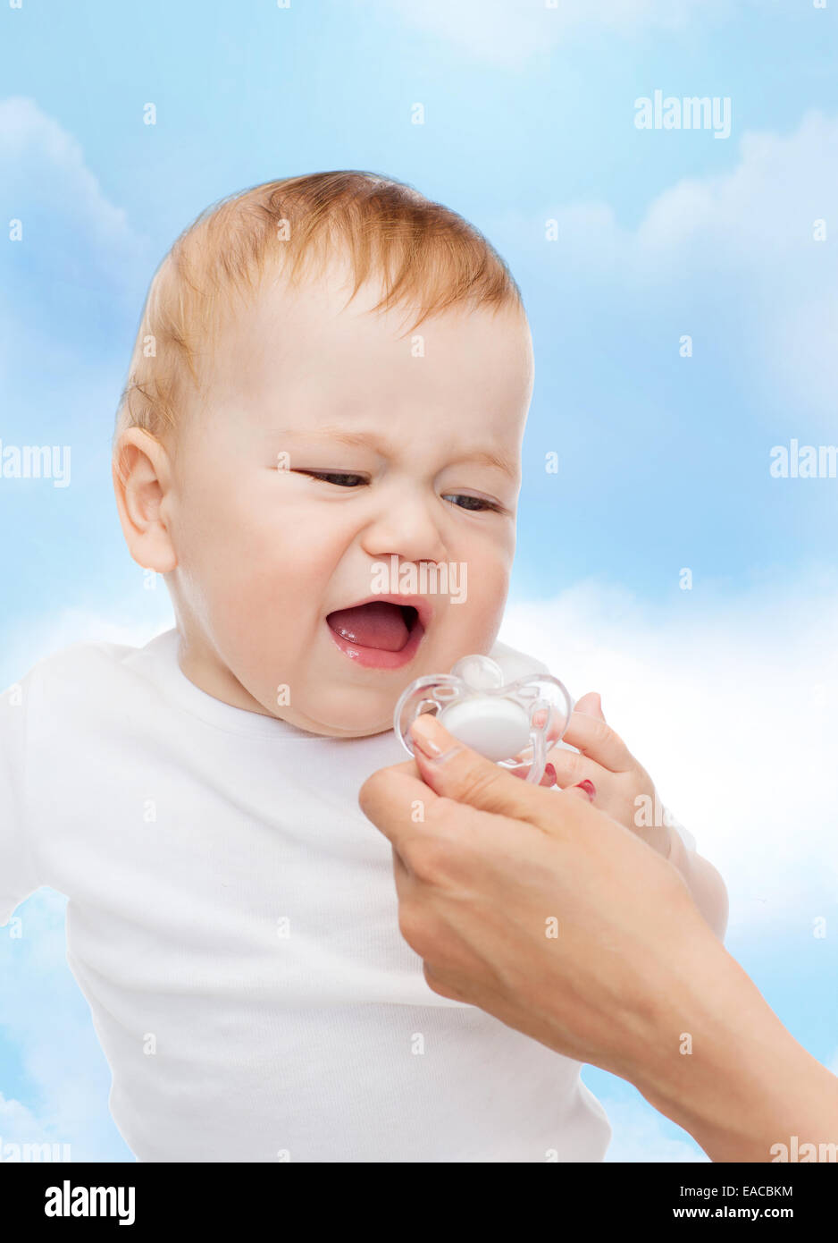 crying baby with dummy Stock Photo Alamy