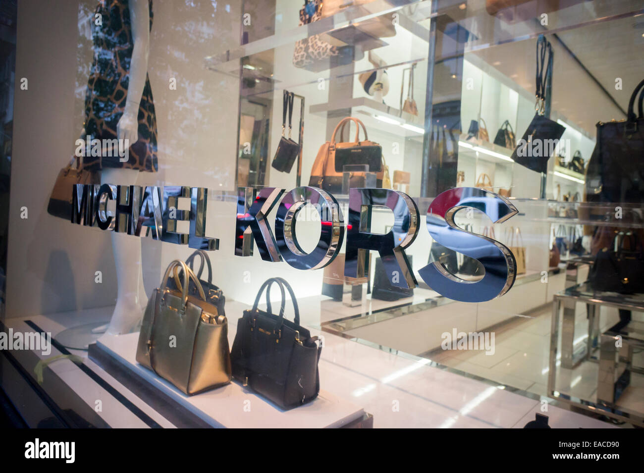 Handbags on display at the Michael Kors boutique within Macy's in New York  on Tuesday, August 4, 2015. First-quarter sales and profits for Michael  Kors handbag designer beat analysts' expectations, albeit low