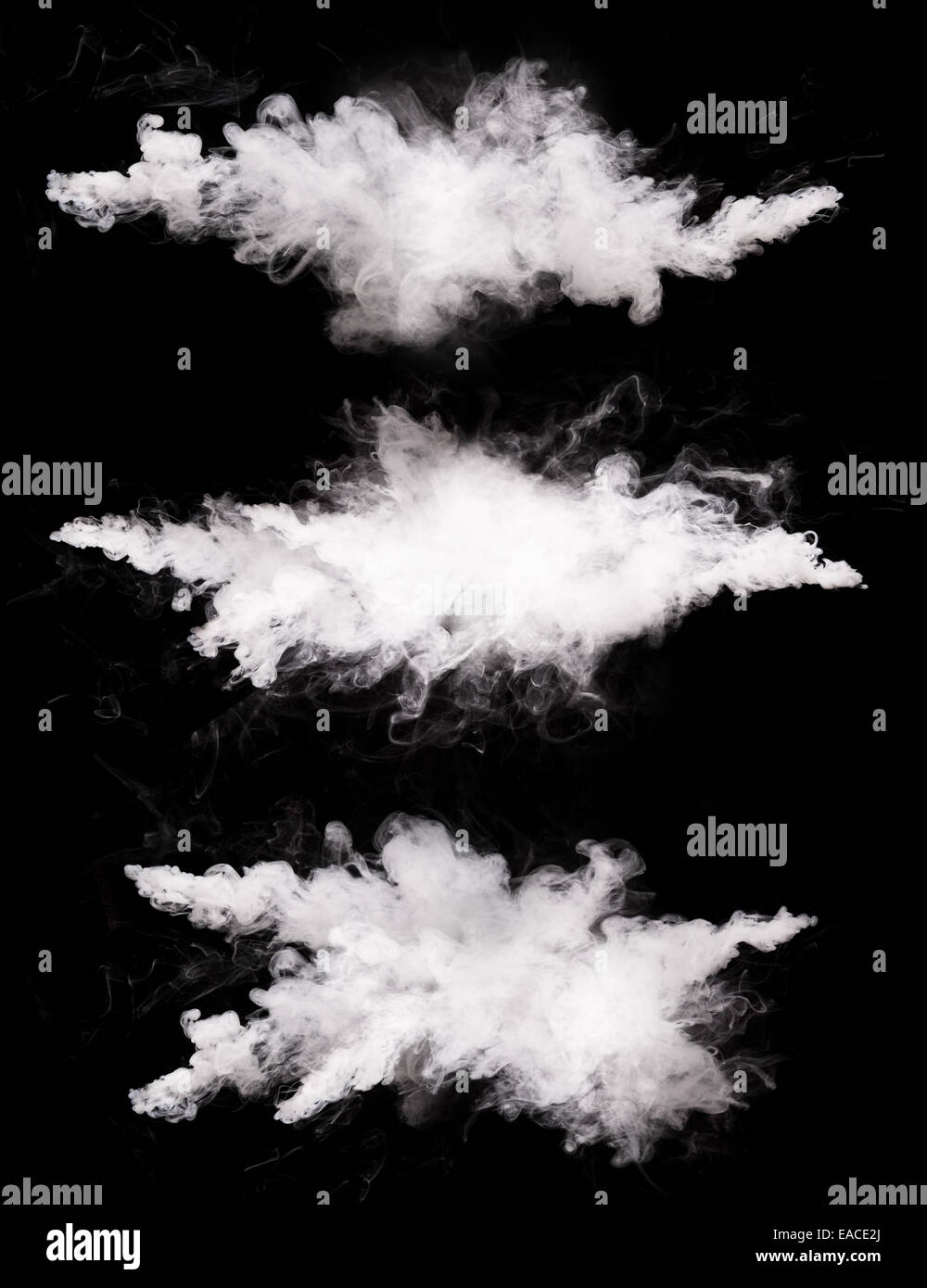 Freeze motions of white dust explosions isolated on black background Stock Photo