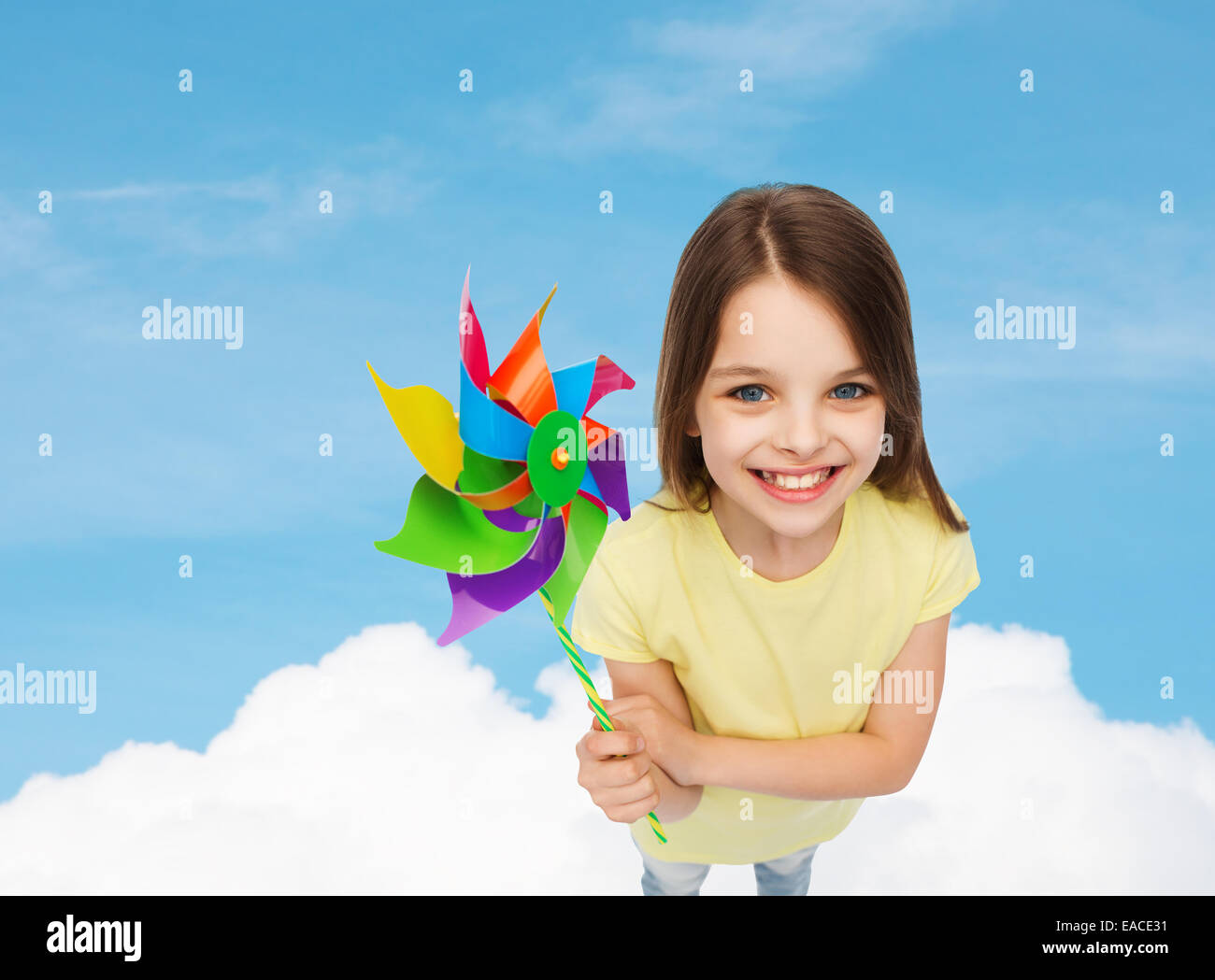 smiling child with colorful windmill toy Stock Photo