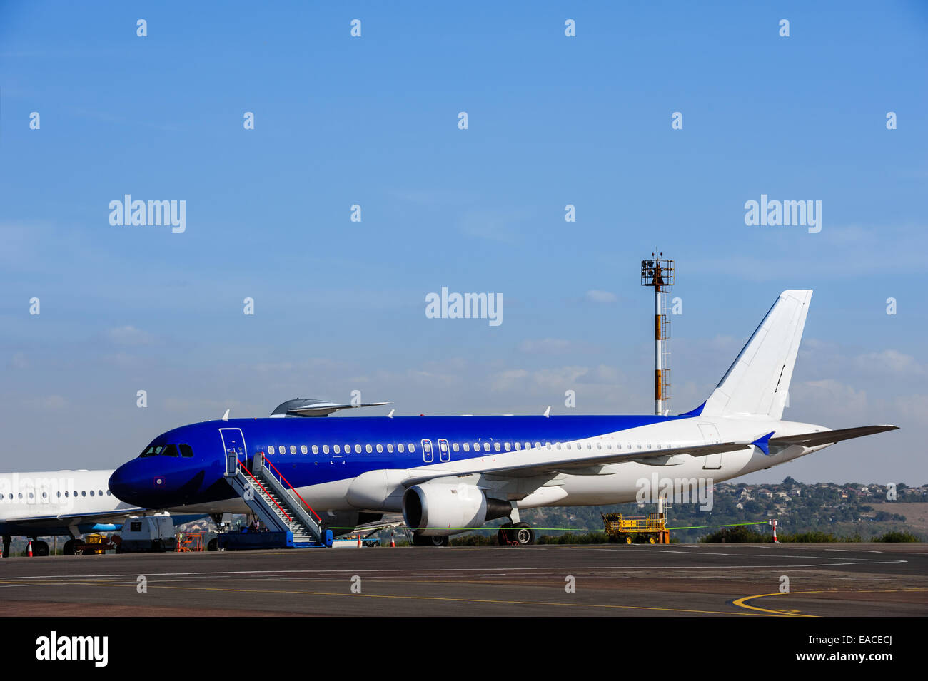 Commercial airplane at airport Stock Photo
