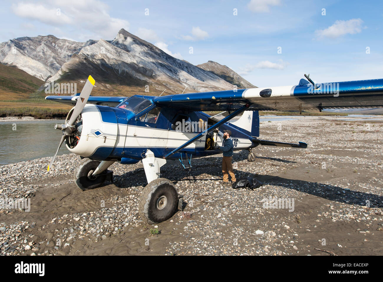 Bushplane arriving at the Noatak River for a river rafting trip, Brooks