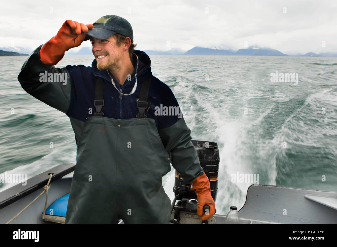 Commercial halibut fishing by hand using longline gear out of an open