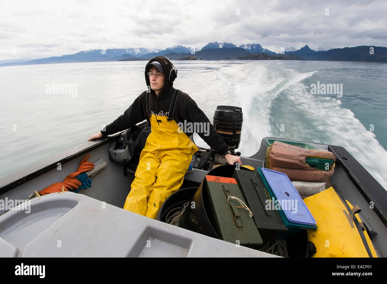 Commercial halibut fishing by hand using longline gear out of an open