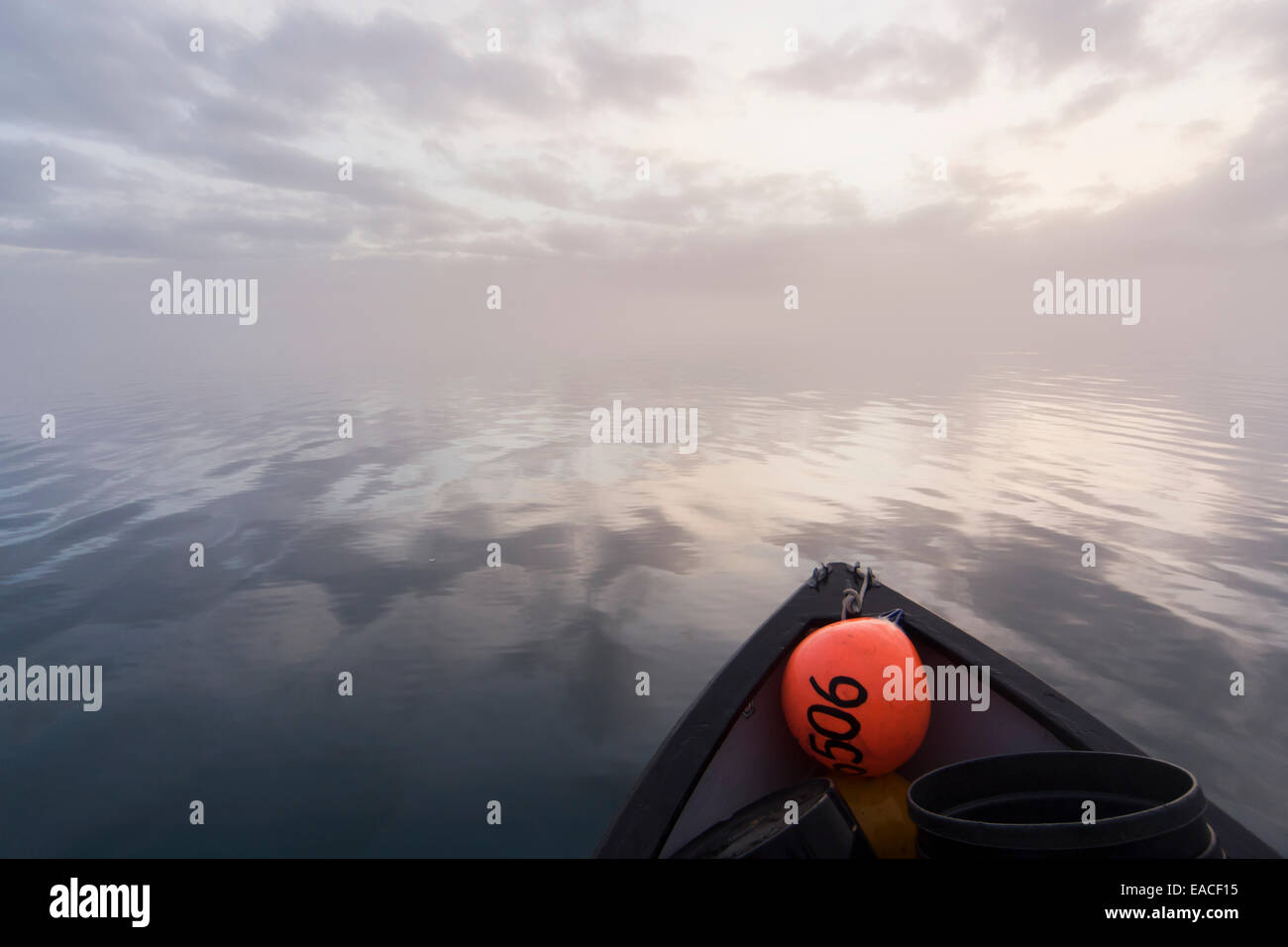 Commercial halibut fishing by hand using longline gear out of an open