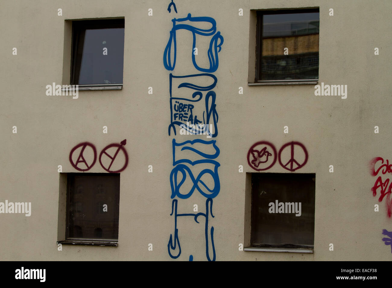 Graffiti street art Berlin wall tags windows mural Stock Photo