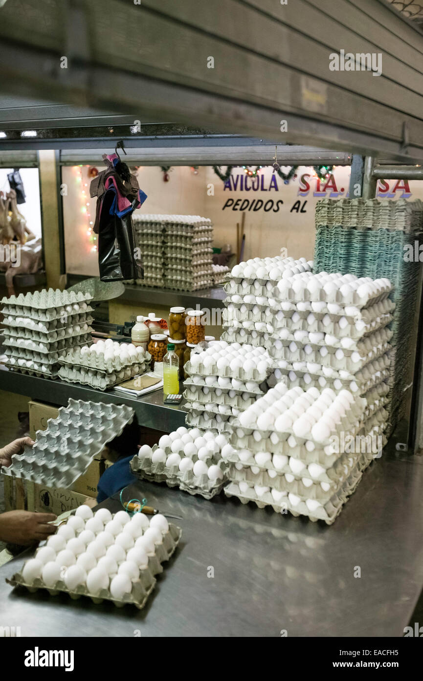 Many fresh white eggs stacked in egg crates for sale in the Mercado Principal, Campeche, Mexico. Stock Photo