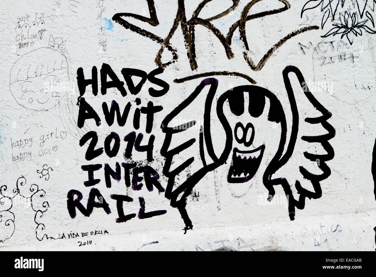 Graffiti street art tags scary ghost angel Stock Photo