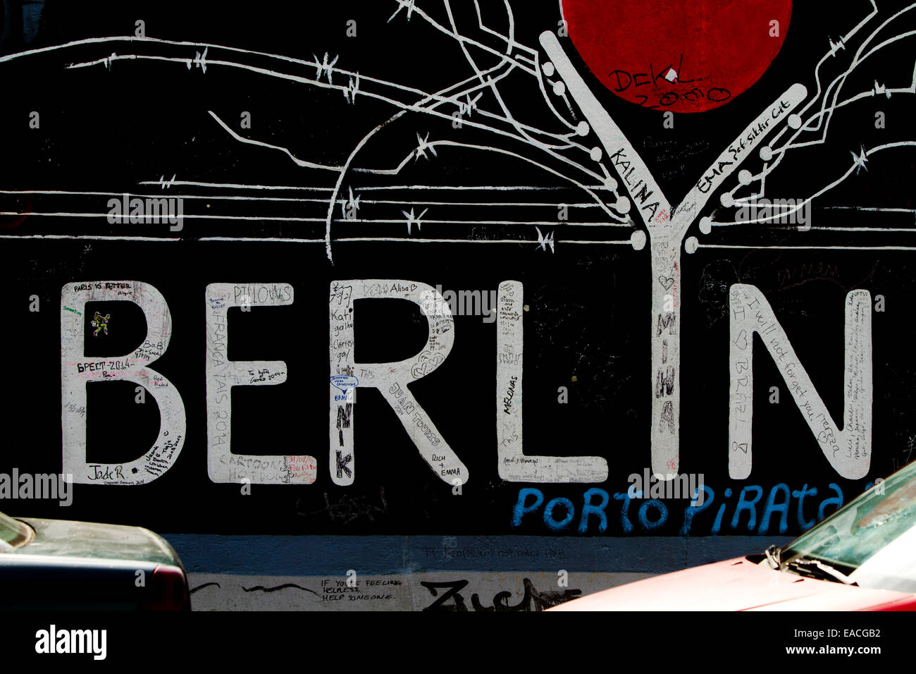 Graffiti street art Berlin Wall barbed wire Stock Photo