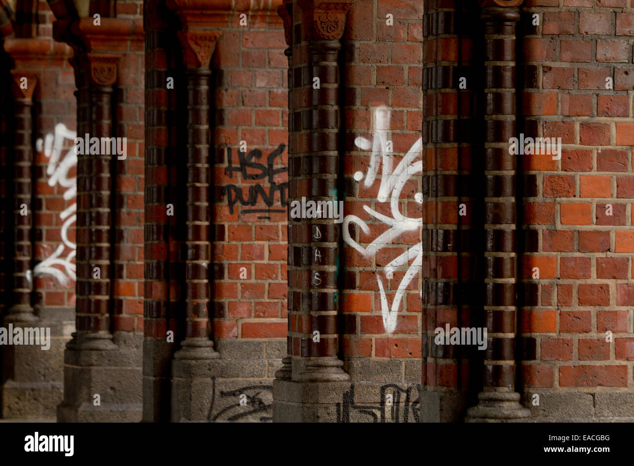 urban brick pillars graffiti bridge Berlin Germany Stock Photo