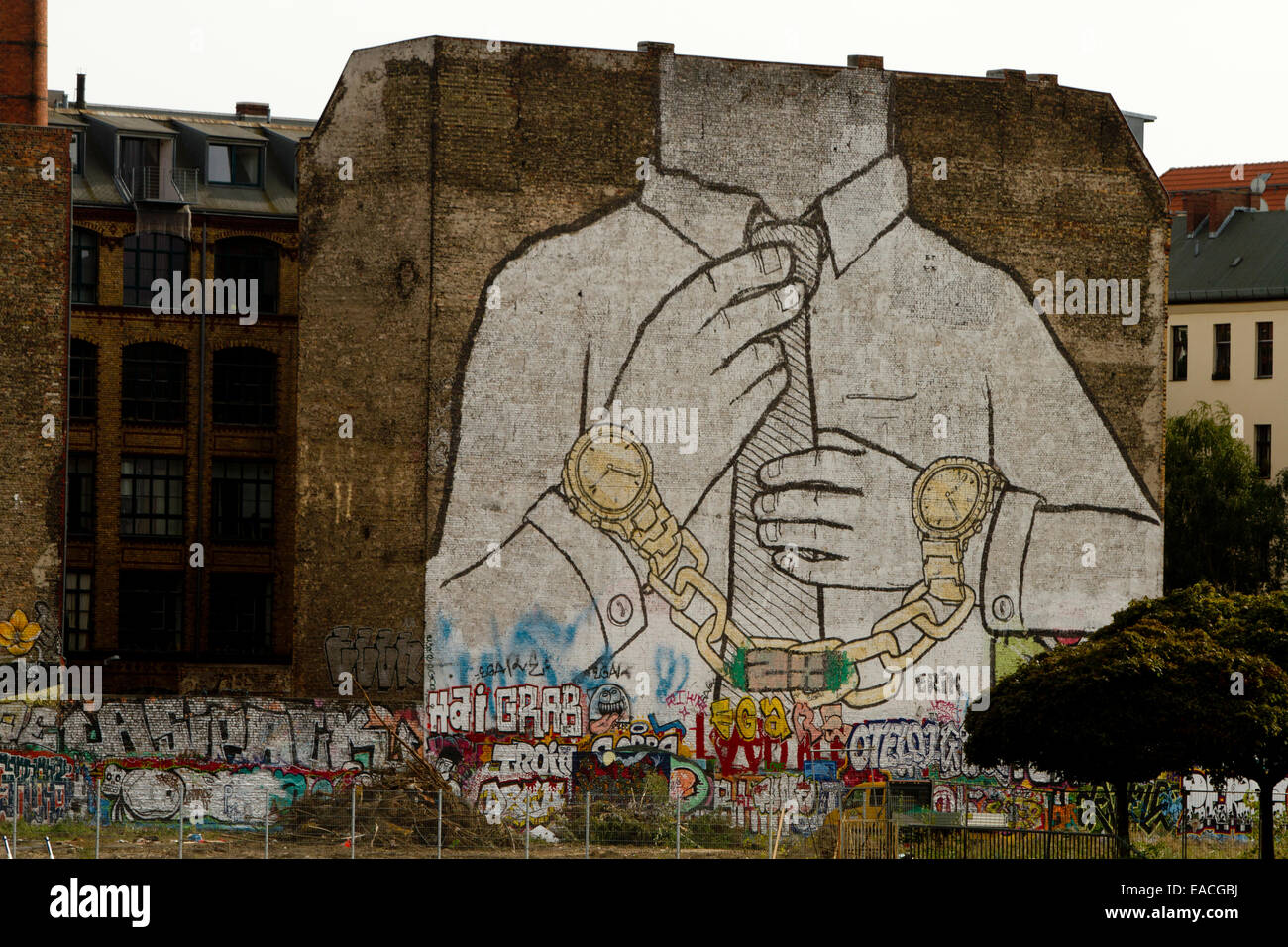 Graffiti building anti capitalism art Berlin wall Stock Photo