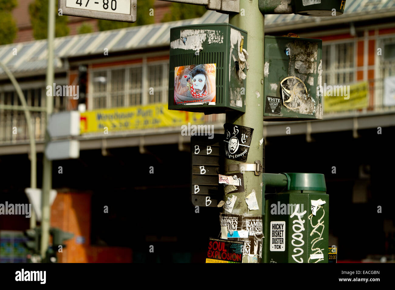 Graffiti lamppost stickers urban street art bridge Stock Photo