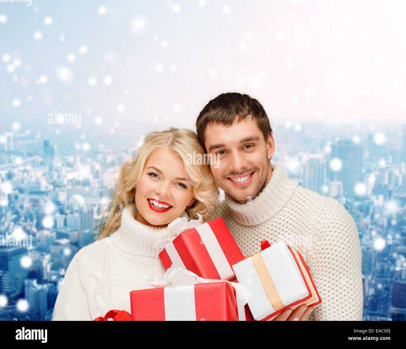 smiling man and woman with presents Stock Photo - Alamy