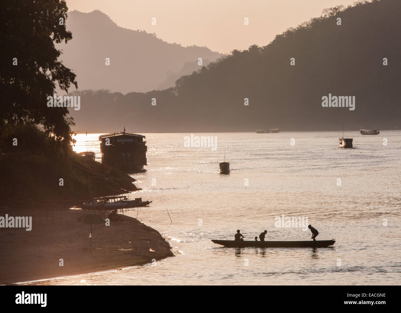 Sunset. Local fishermen fishing on Mekong River at Luang Prabang, Laos, South East Asia, Asia, Stock Photo