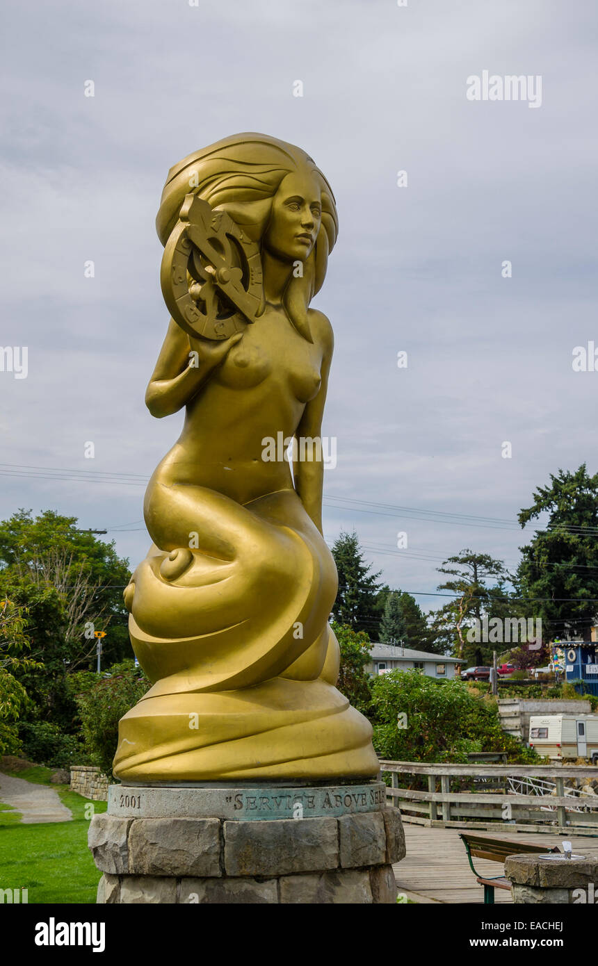 Golden mermaid statue, with the motto "Service above Self" inscribed on the pedestal, Ganges
