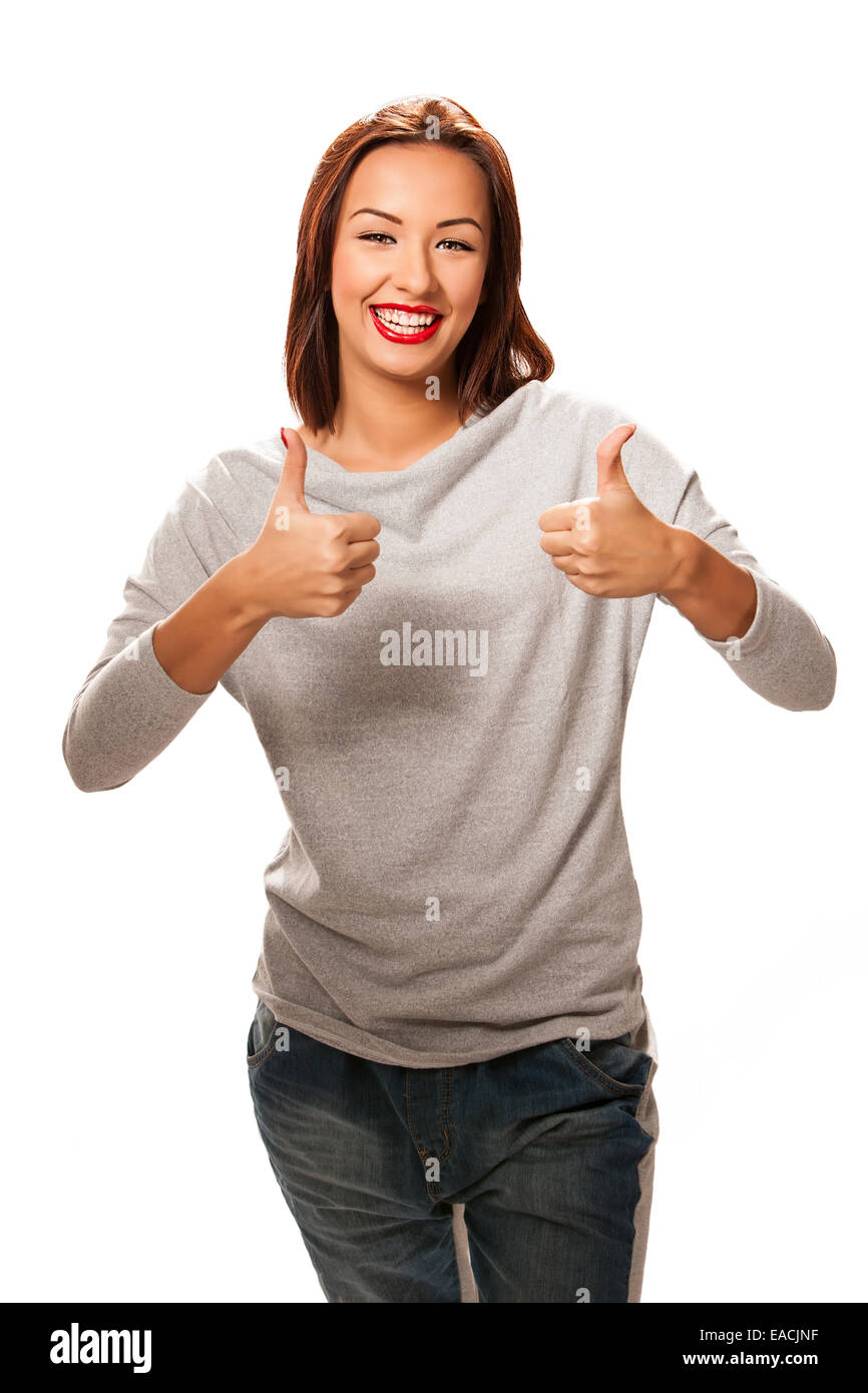 Beautiful happy young woman giving thumbs up. Stock Photo