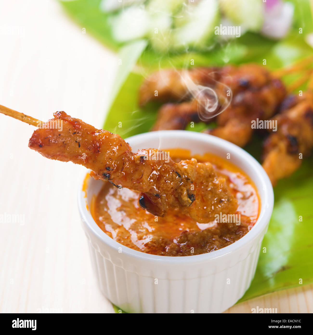 Delicious chicken sate or satay, skewered and grilled meat, served with