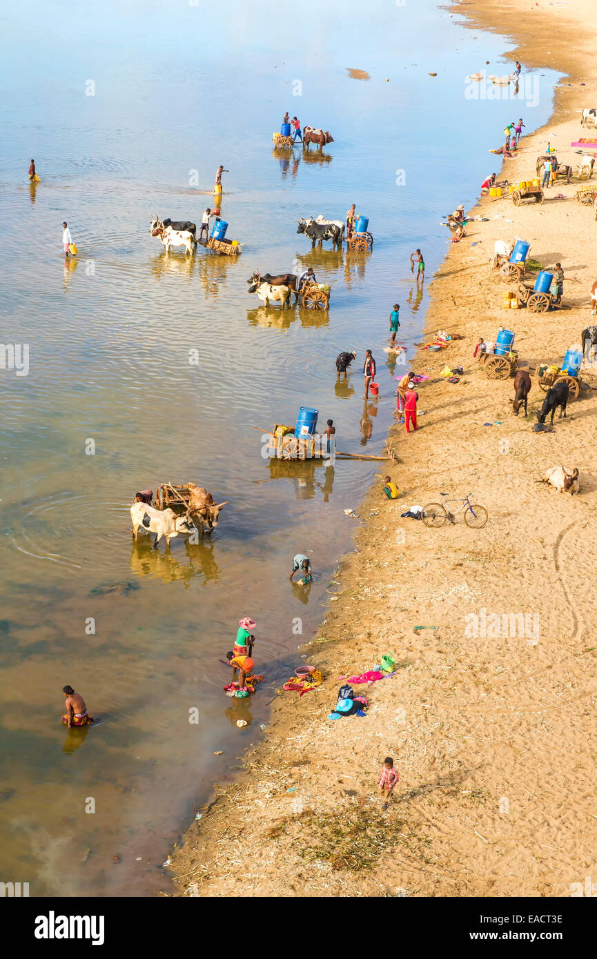 People washing and taking water from the Mandare river, Berenty, Fort Dauphin, Toliara Province, Madagascar Stock Photo
