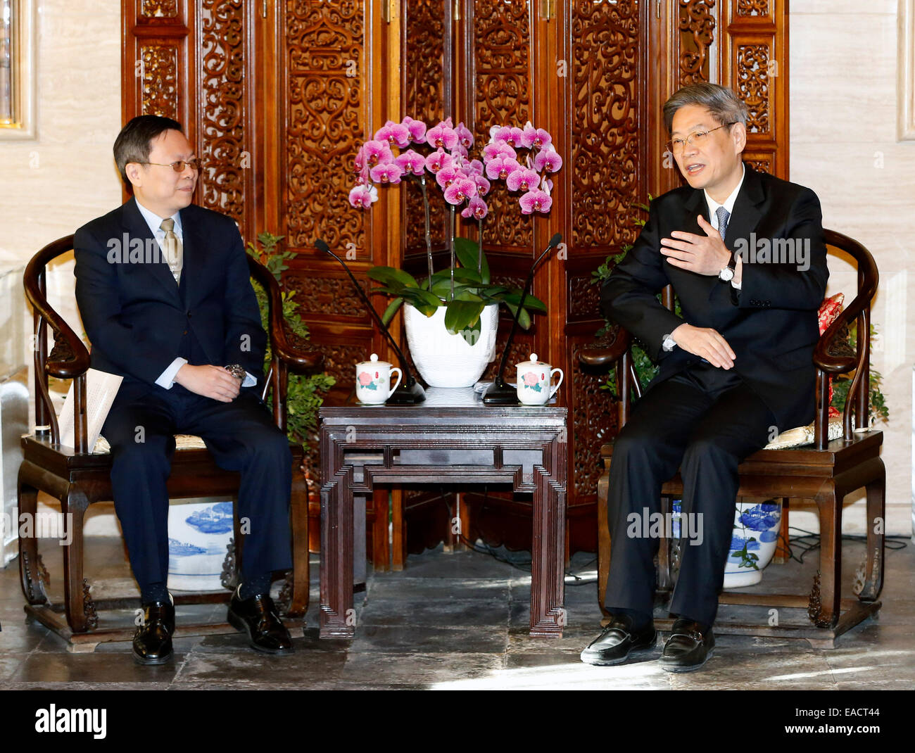 Beijing, China. 12th Nov, 2014. Zhang Zhijun (R), head of the State ...
