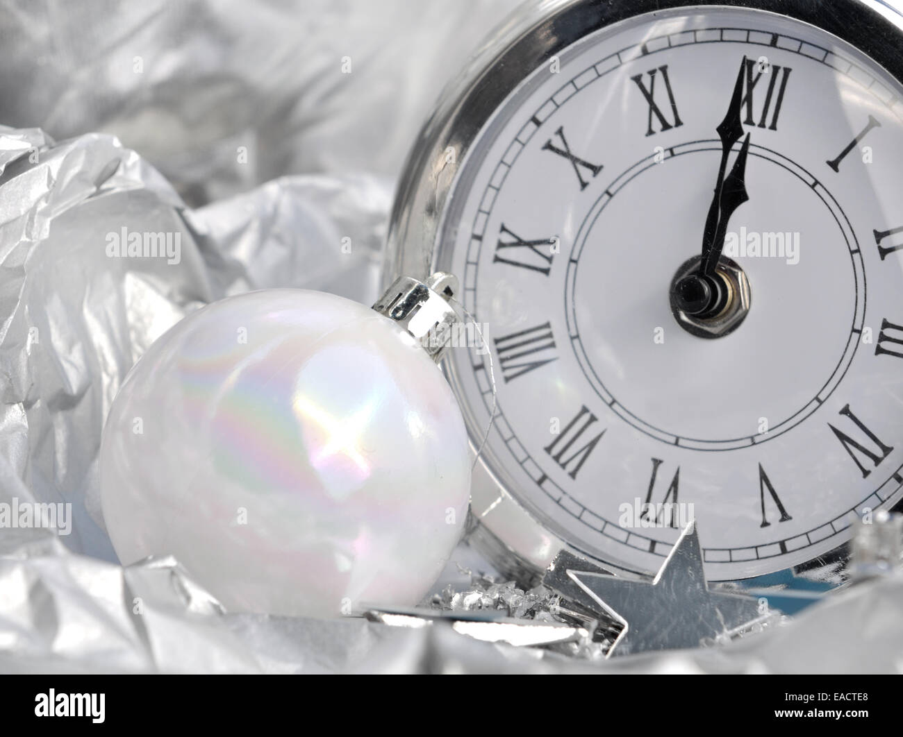 clock striking midnight silver in  holiday decor Stock Photo