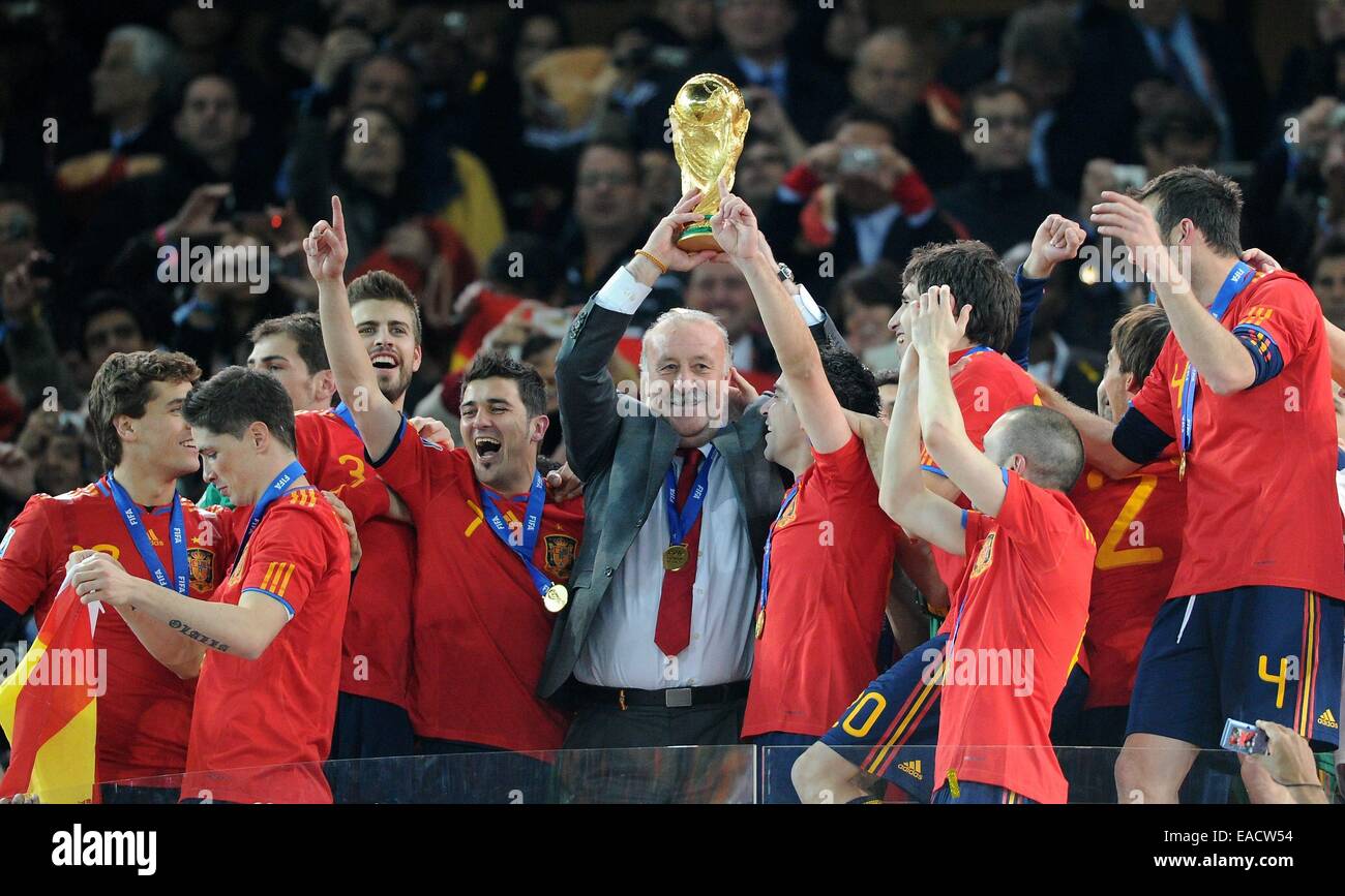 FILE - An archive photo dated 11 July 2010 shows Spain's coach Vicente del Bosque (C), Xavi (R) and David Villa lifting the World Cup trophy after the 2010 FIFA World Cup final match between the Netherlands and Spain at Soccer City Stadium in Johannesburg, South Africa. Photo: MARCUS BRANDT/dpa Stock Photo