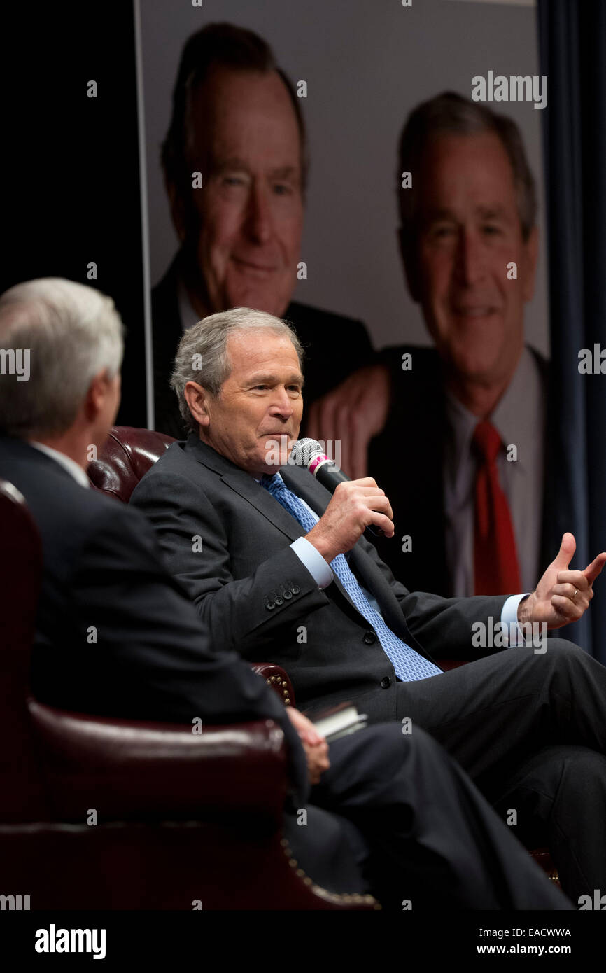 College Station, Texas, USA. 11th November, 2014. Former U.S. President George W. Bush talks about his new book, '41 A Portrait of My Father' with former chief of staff Andrew Card during a book event at the Bush Library at Texas A&M University. The elder George H.W. Bush and wife Barbara were in the audience. Credit:  Bob Daemmrich/Alamy Live News Stock Photo